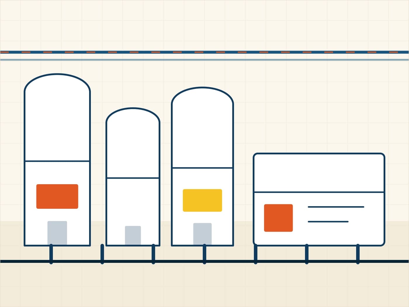 Row of insulated vertical milk storage silos with an overhead pipe rack